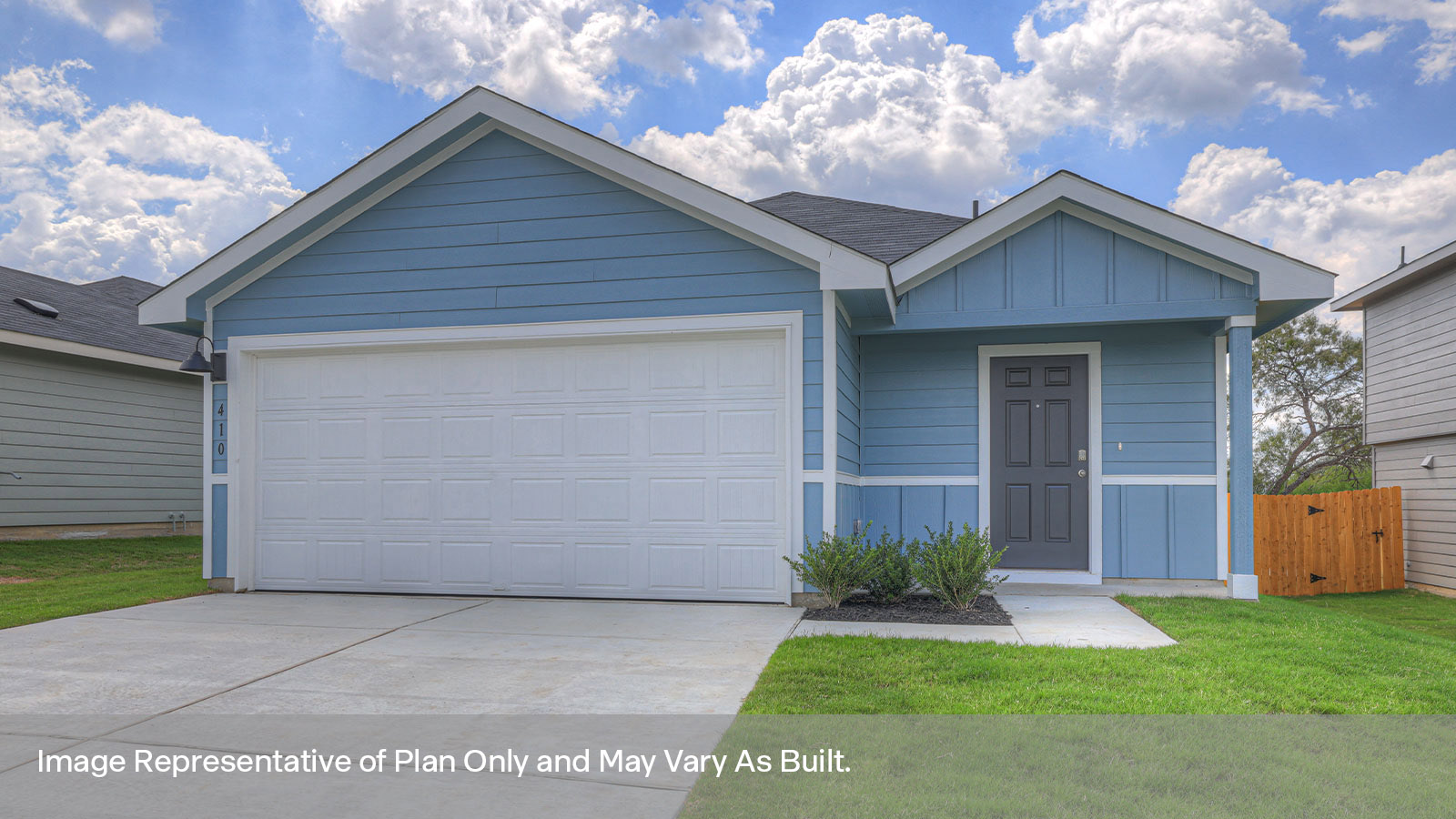 Single-story farmhouse with 2 car garage.