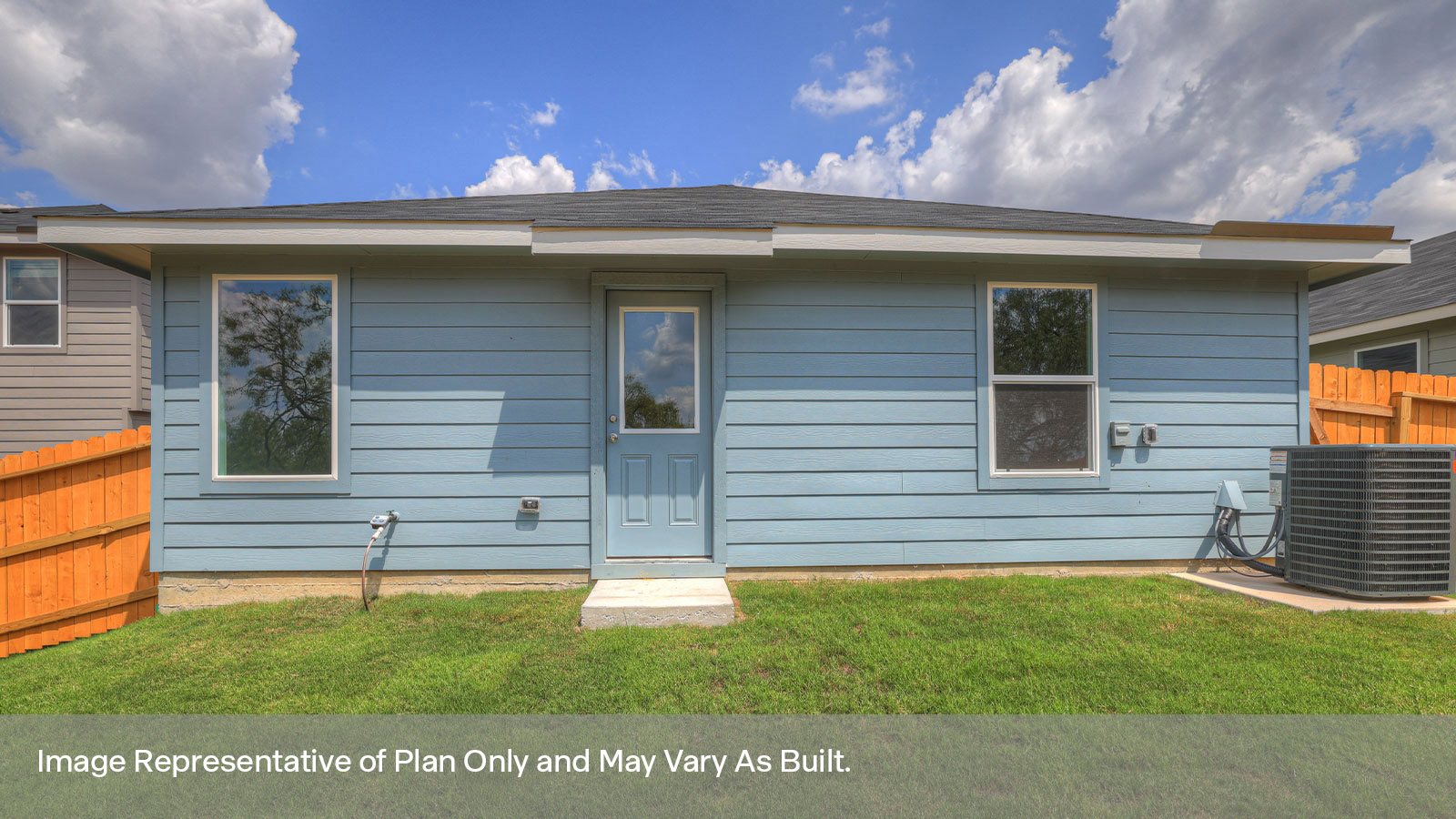 Backyard with sod and privacy fence.