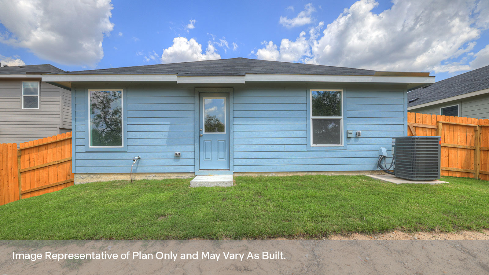 Backyard with sod and privacy fence.