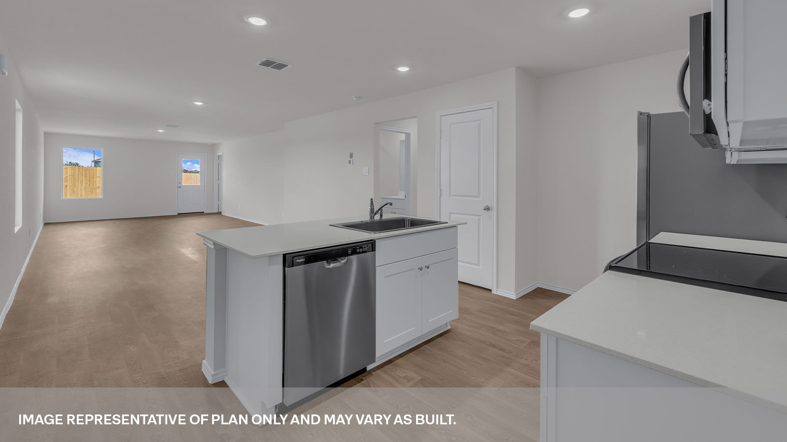 Kitchen with kitchen island and quartz countertops.