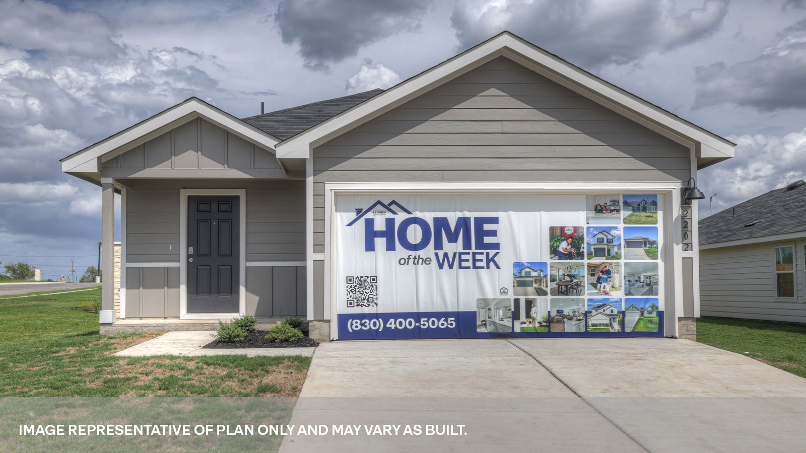 Single-story farmhouse with 2 car garage.