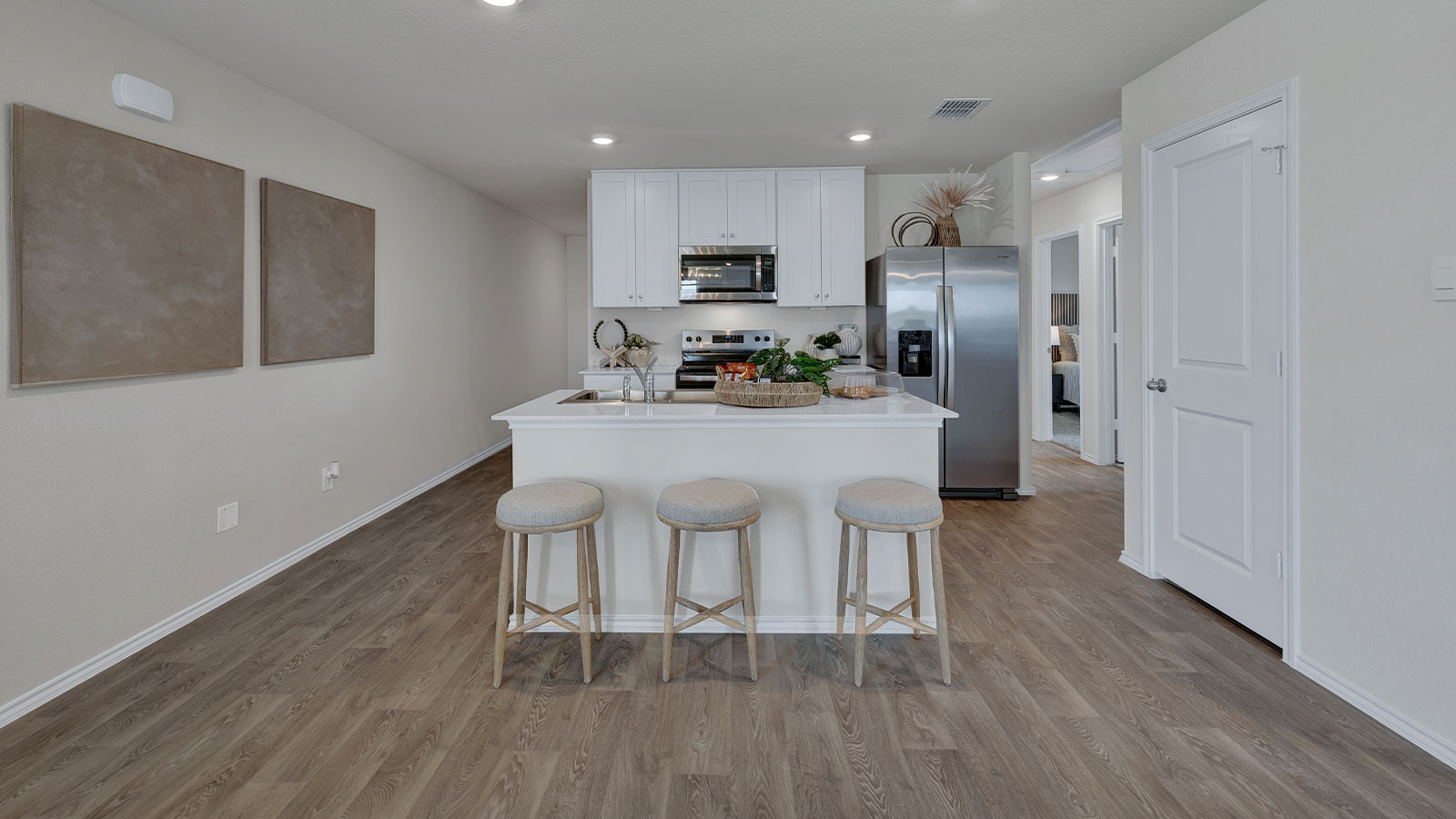 Kitchen with quartz countertops and stainless-steel appliances.