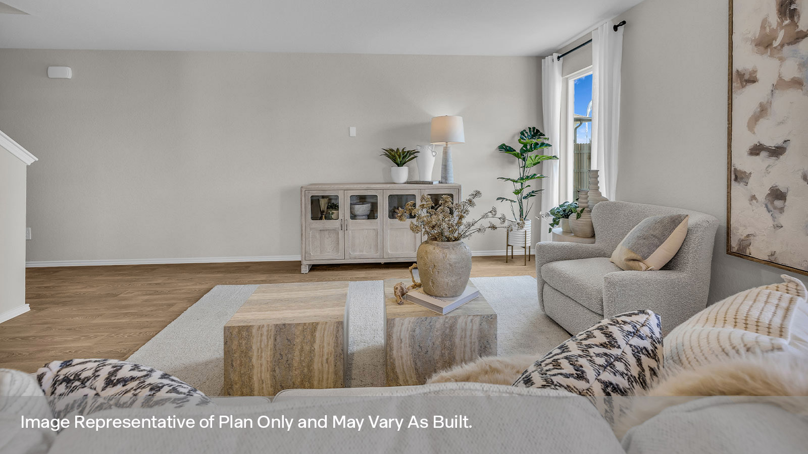 Living room with vinyl flooring, one window, and a half lite exterior door.