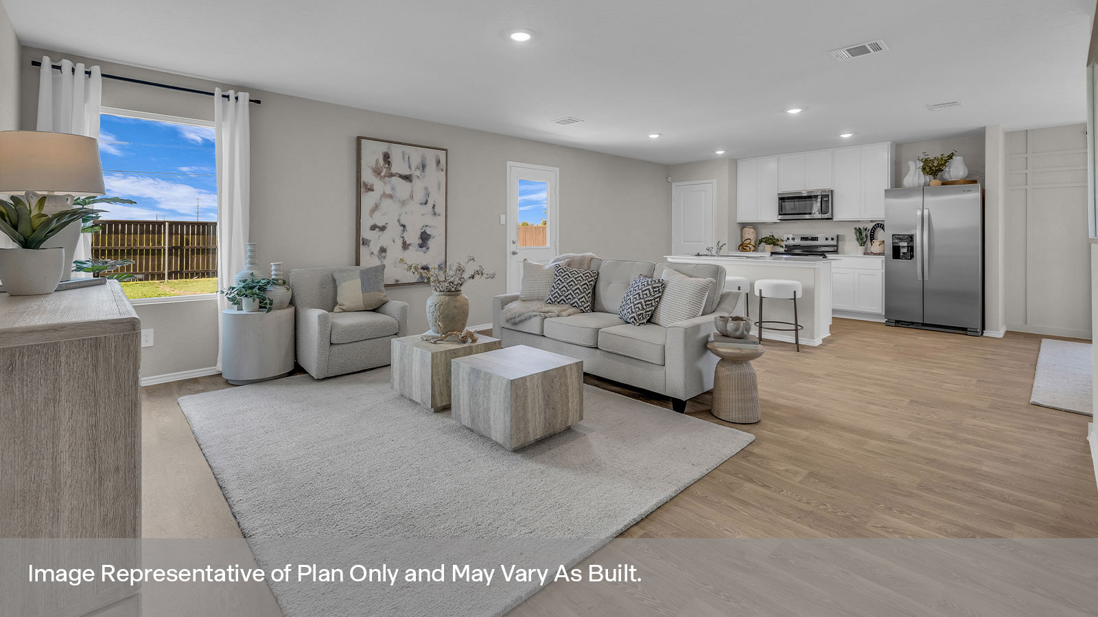 Living room with vinyl flooring, one window, and a half lite exterior door.