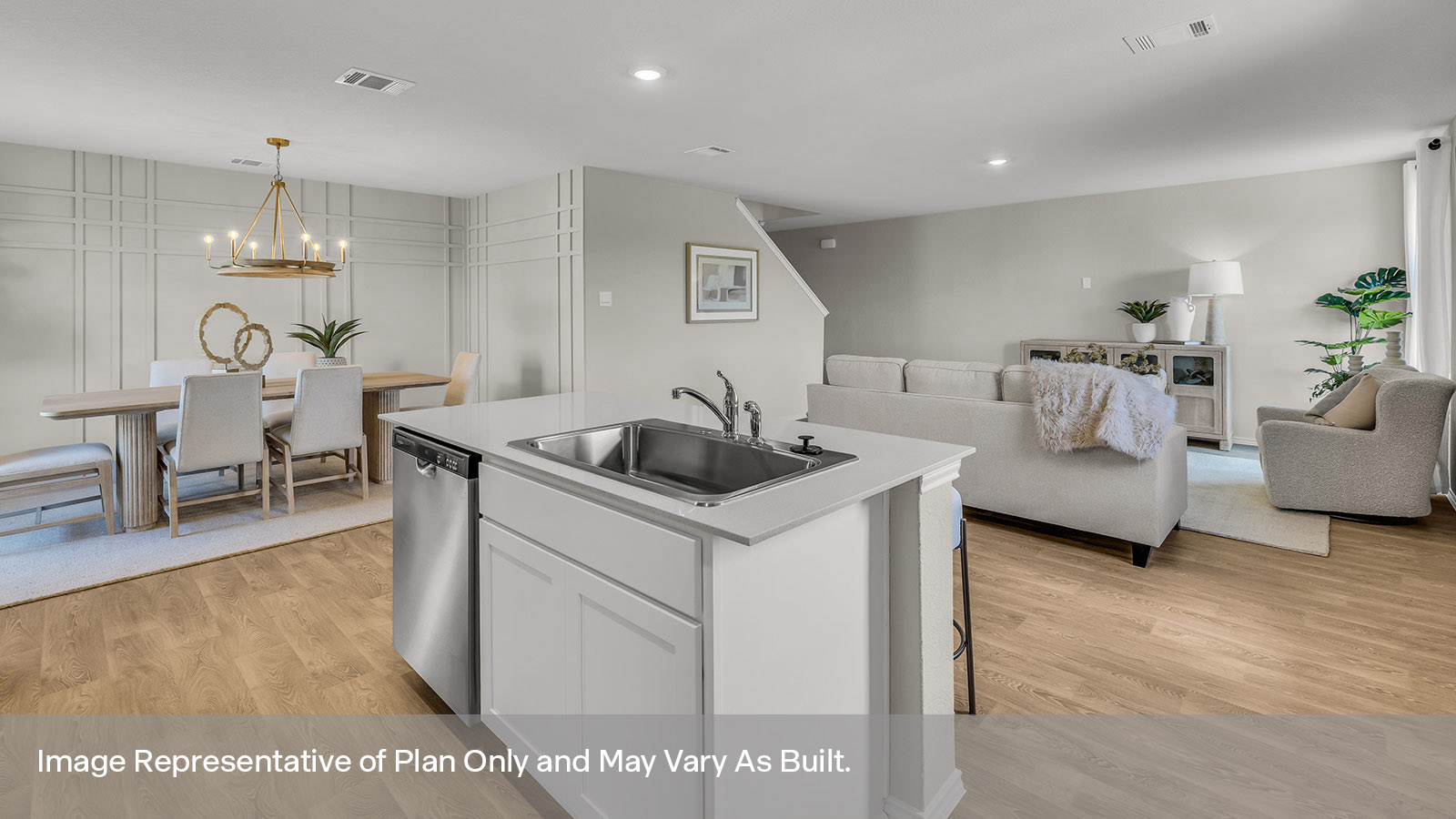 Kitchen with kitchen island and stainless steel appliances.