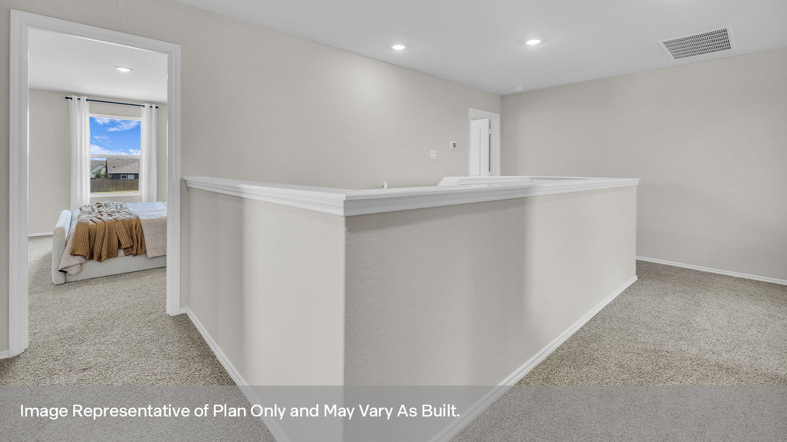 Bedroom hallway with carpeting leading to the main bedroom.