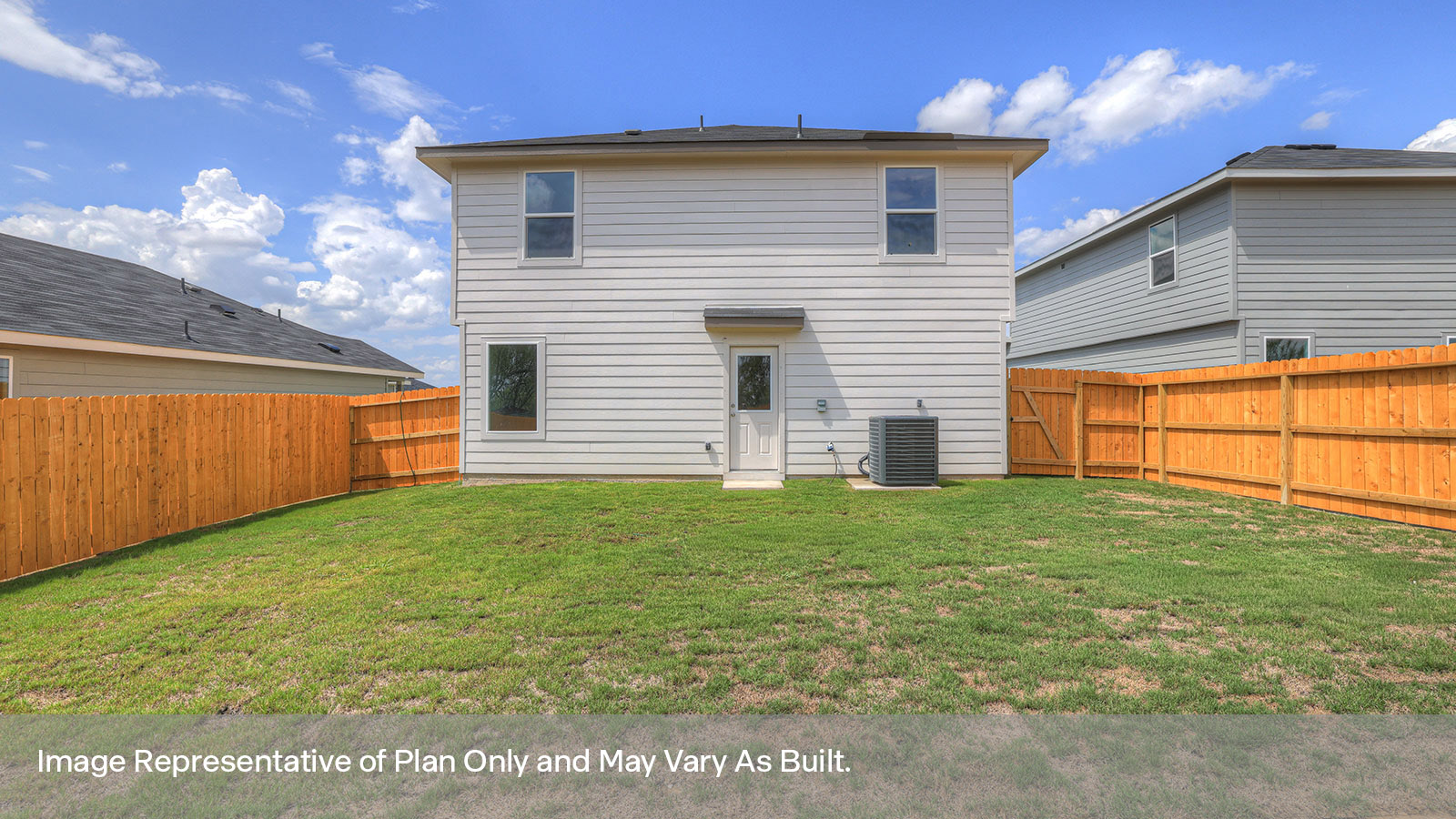 Backyard with sod and privacy fence.