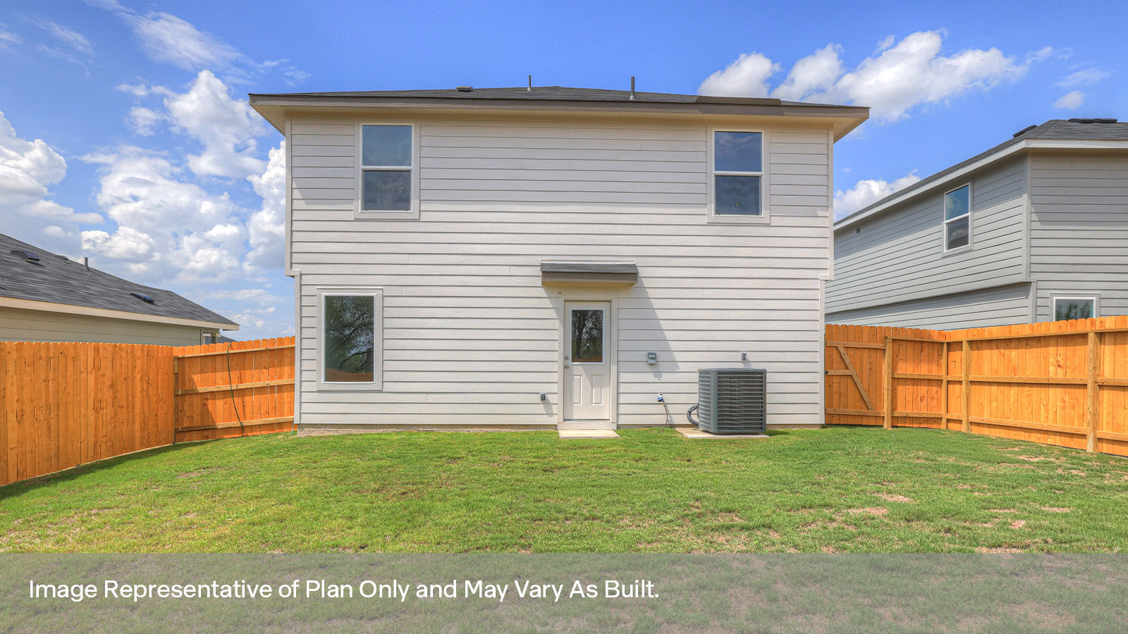 Backyard with sod and privacy fence.