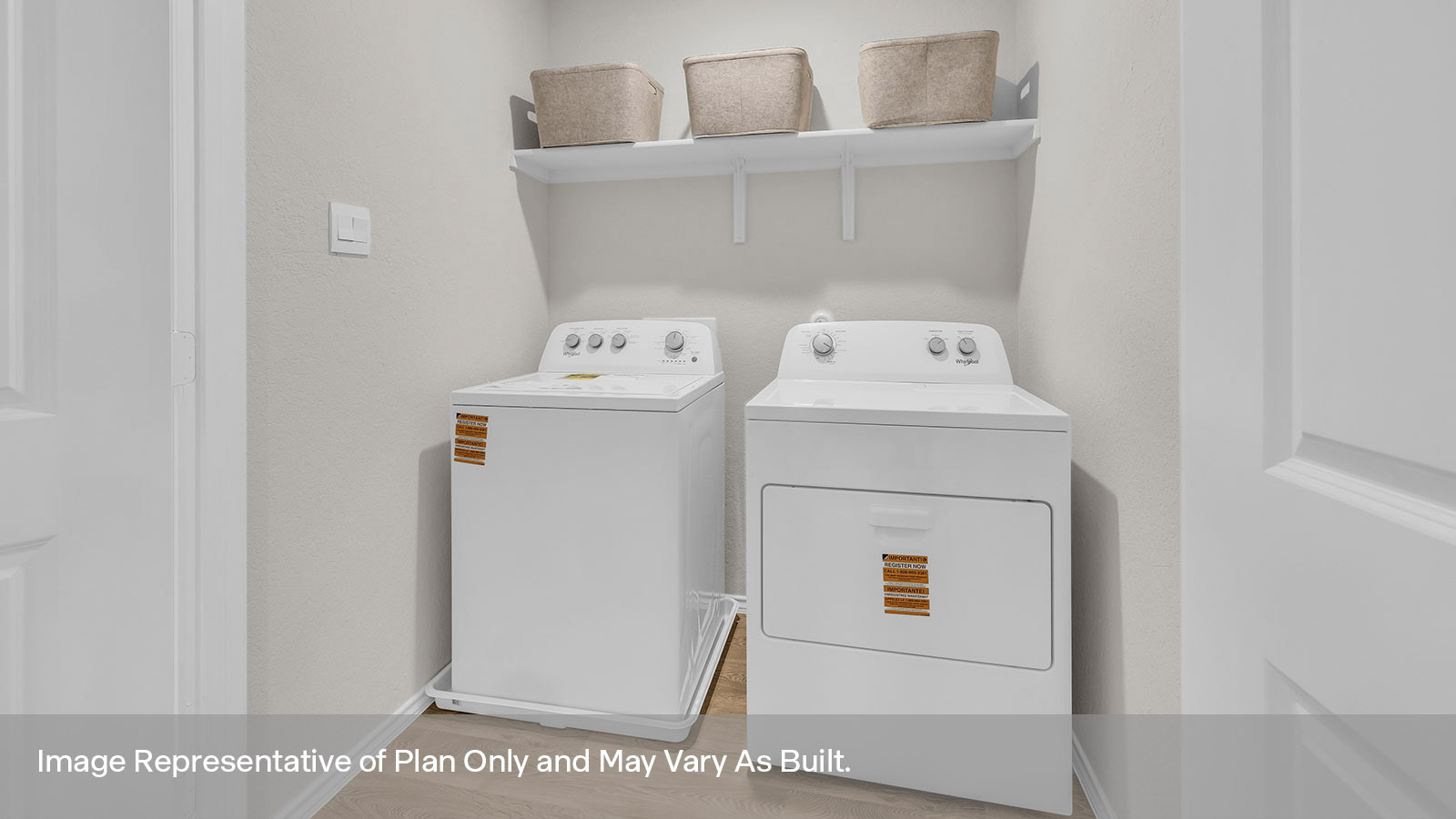 Utility room with washer/dryer connections and wooden shelving.