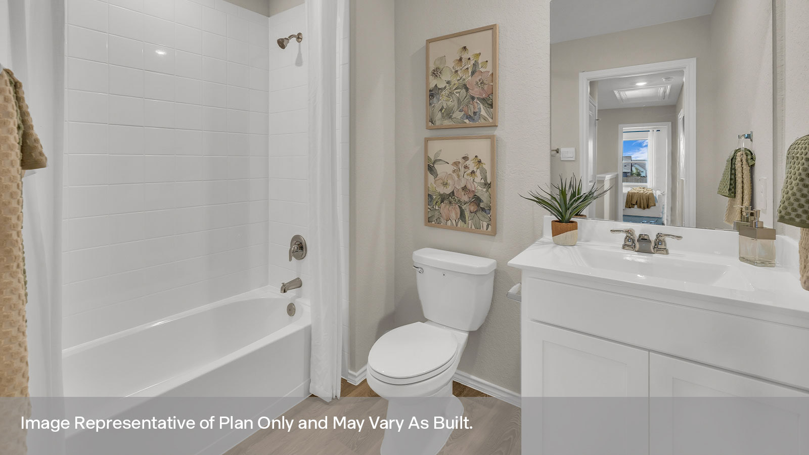 Hall bathroom with sink, toilet, and tub with tile surround.