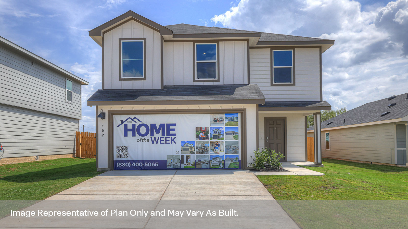 Two-story farmhouse exterior photo with 2 car garage.