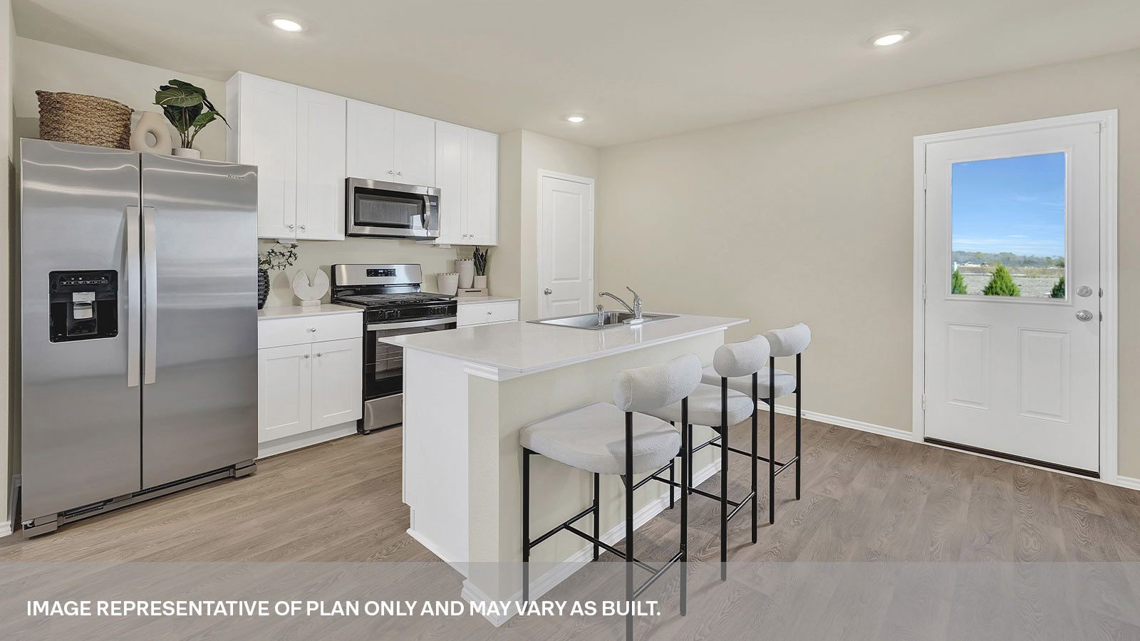 Kitchen with kitchen island and white cabinets.
