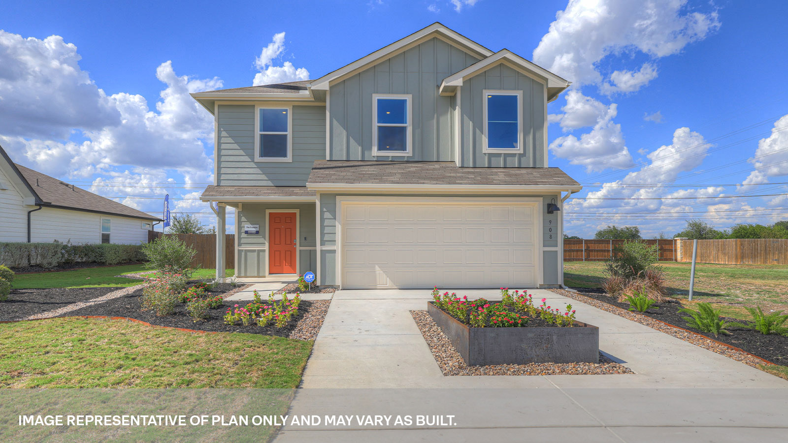 Two-story farmhouse exterior with 2 car garage.