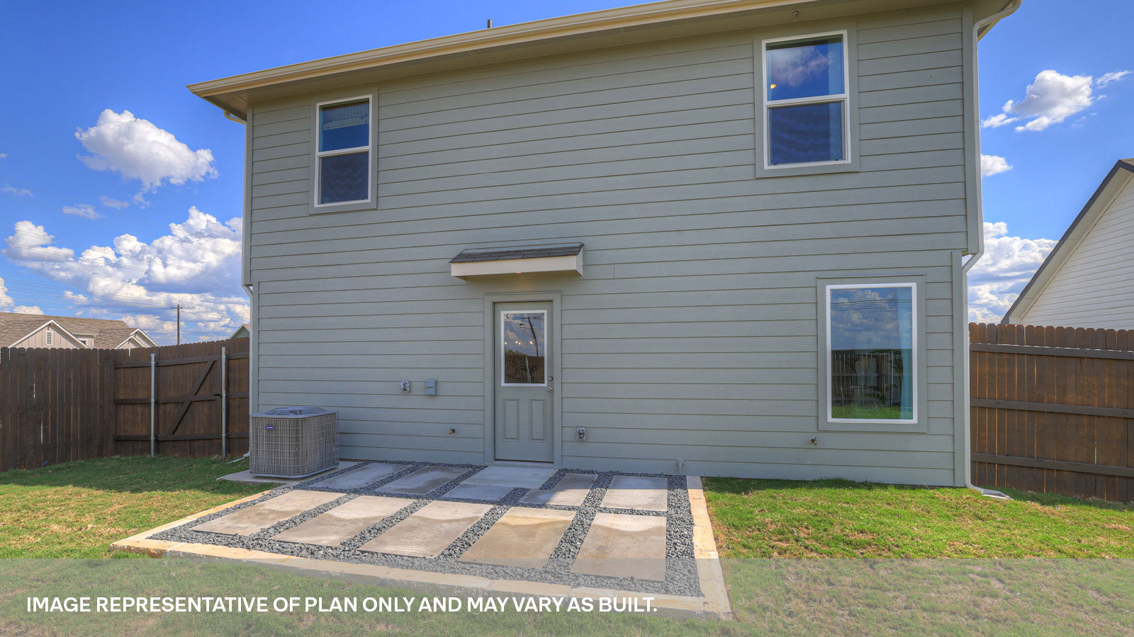 Backyard with sod and privacy fence.
