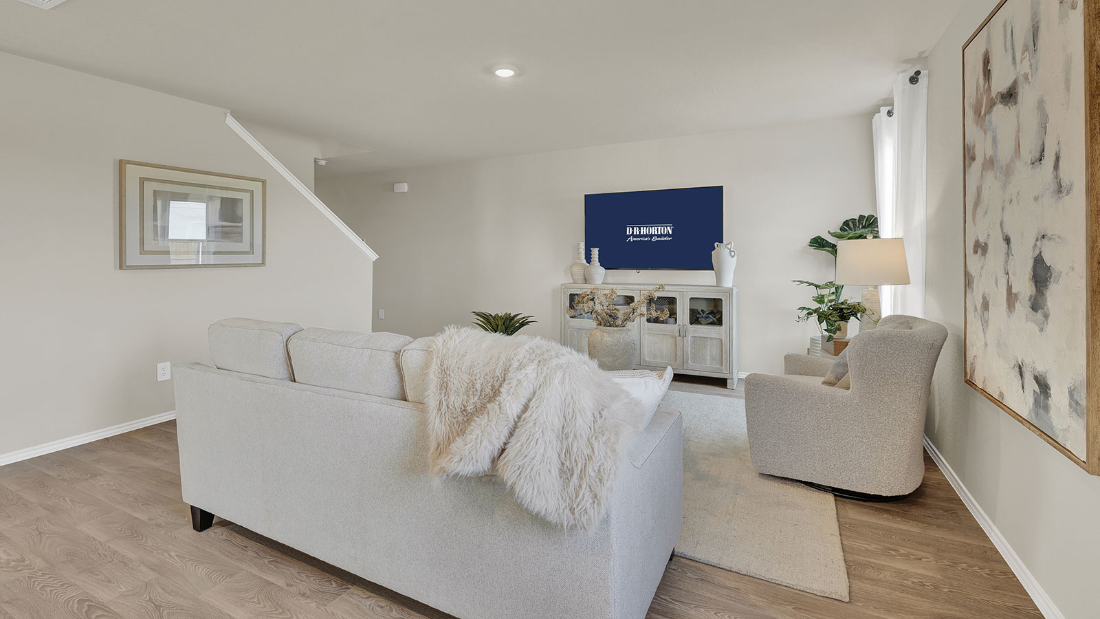 Living room with vinyl flooring with one window and a half lite exterior door.