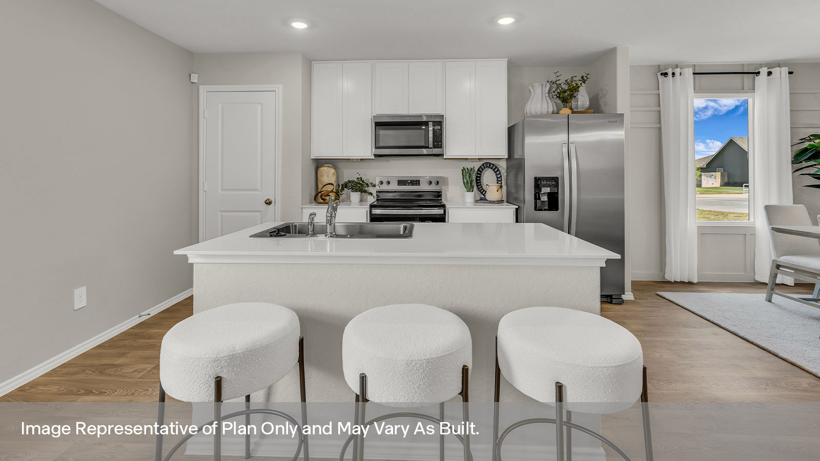 Kitchen with kitchen island and quartz countertops.