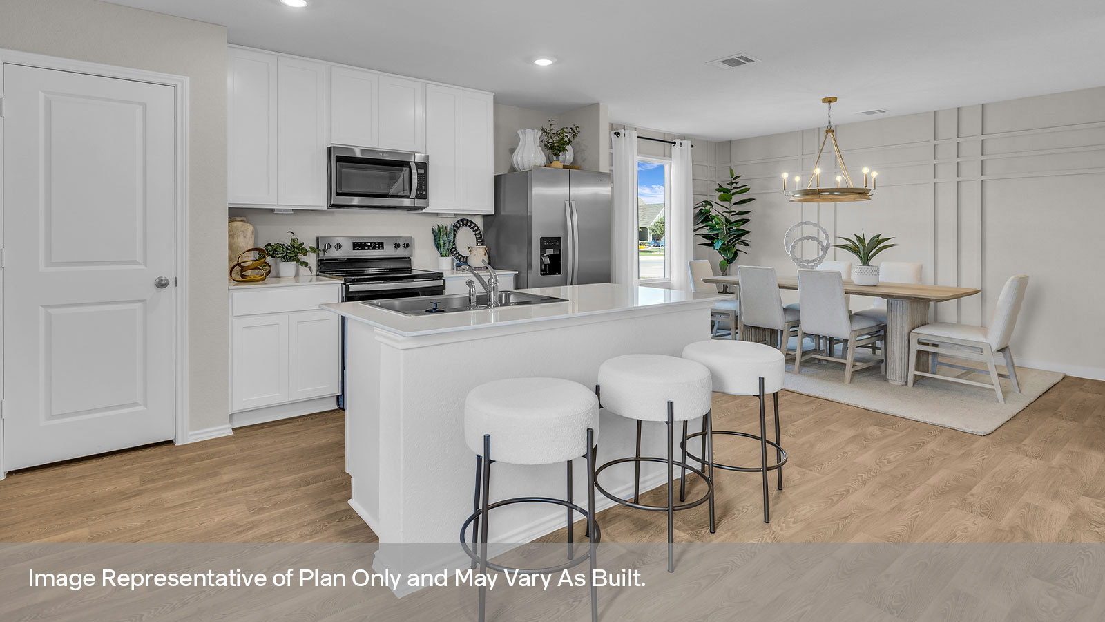 Kitchen with kitchen island and white cabinets.