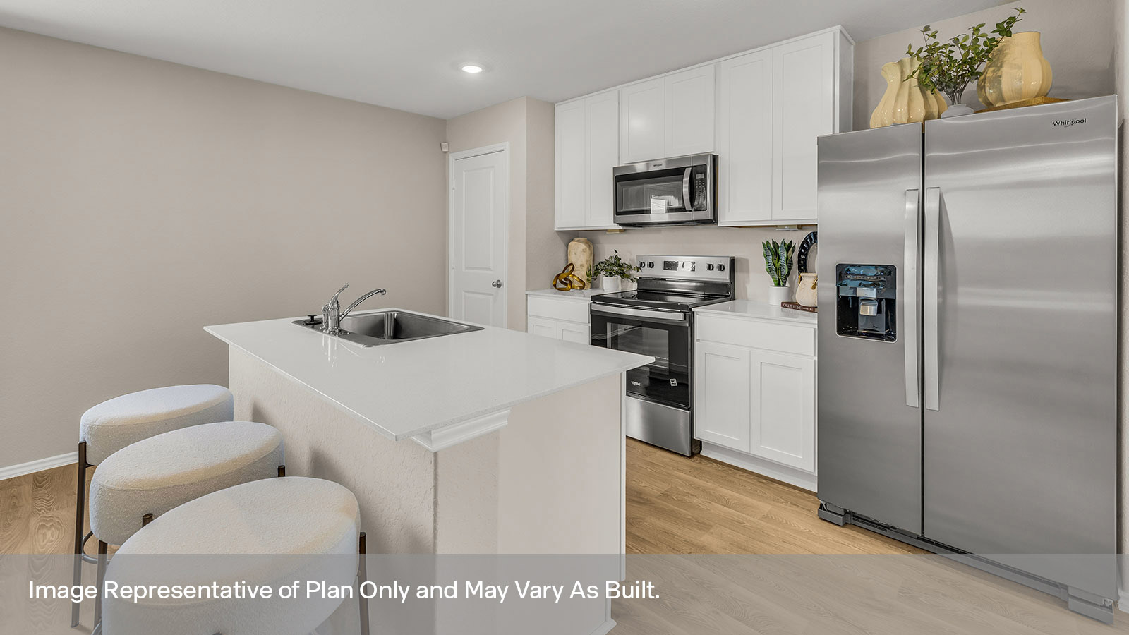 Kitchen with kitchen island and white cabinets.
