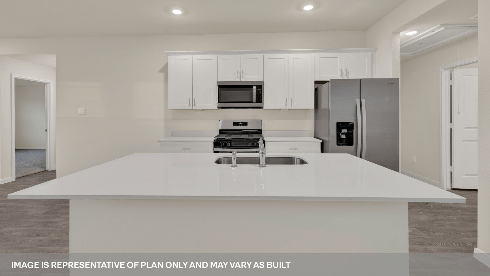 kitchen with white cabinetry, large island, and stainless steel appliances