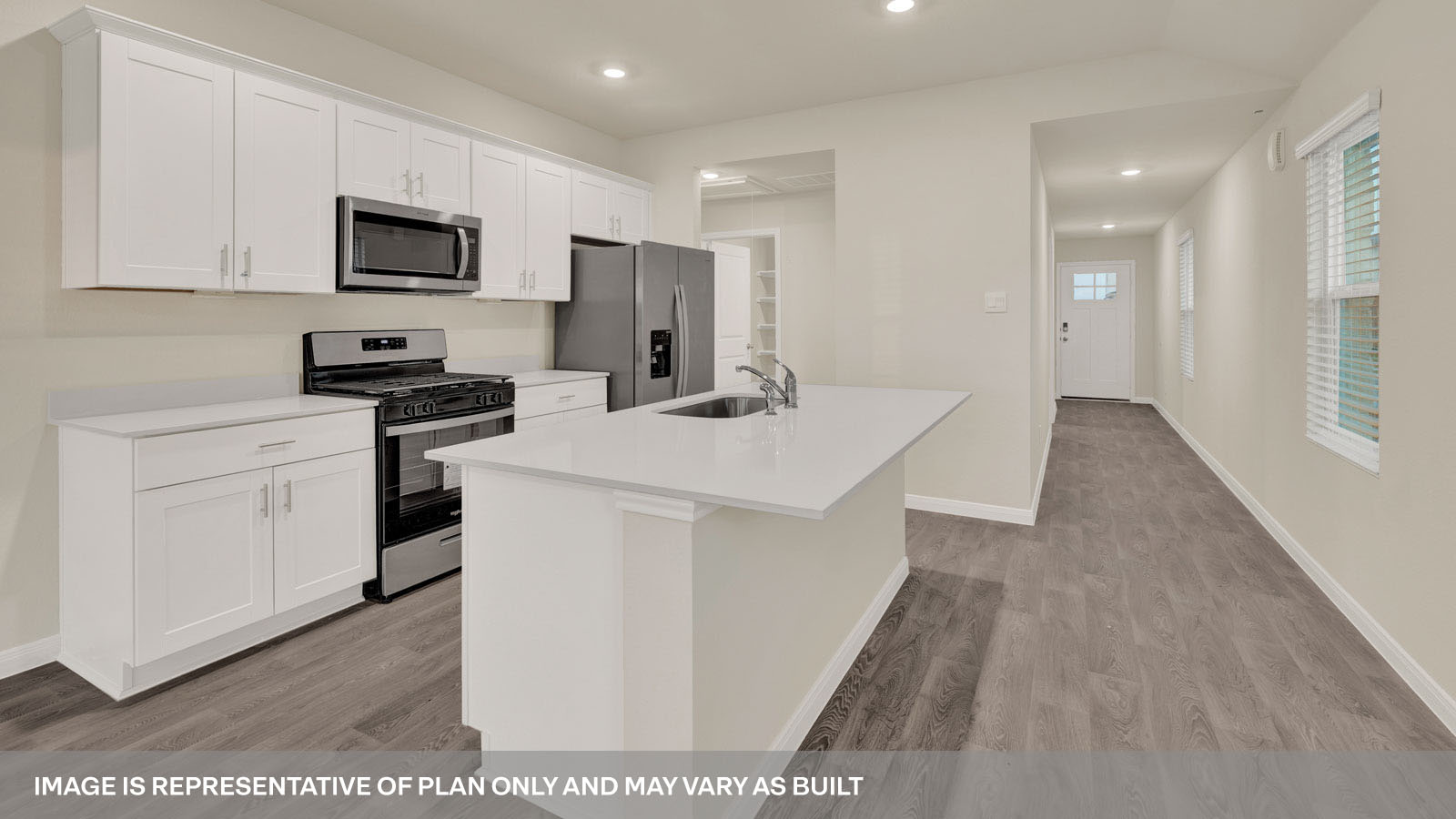 kitchen with white cabinetry, large island, and stainless steel appliances