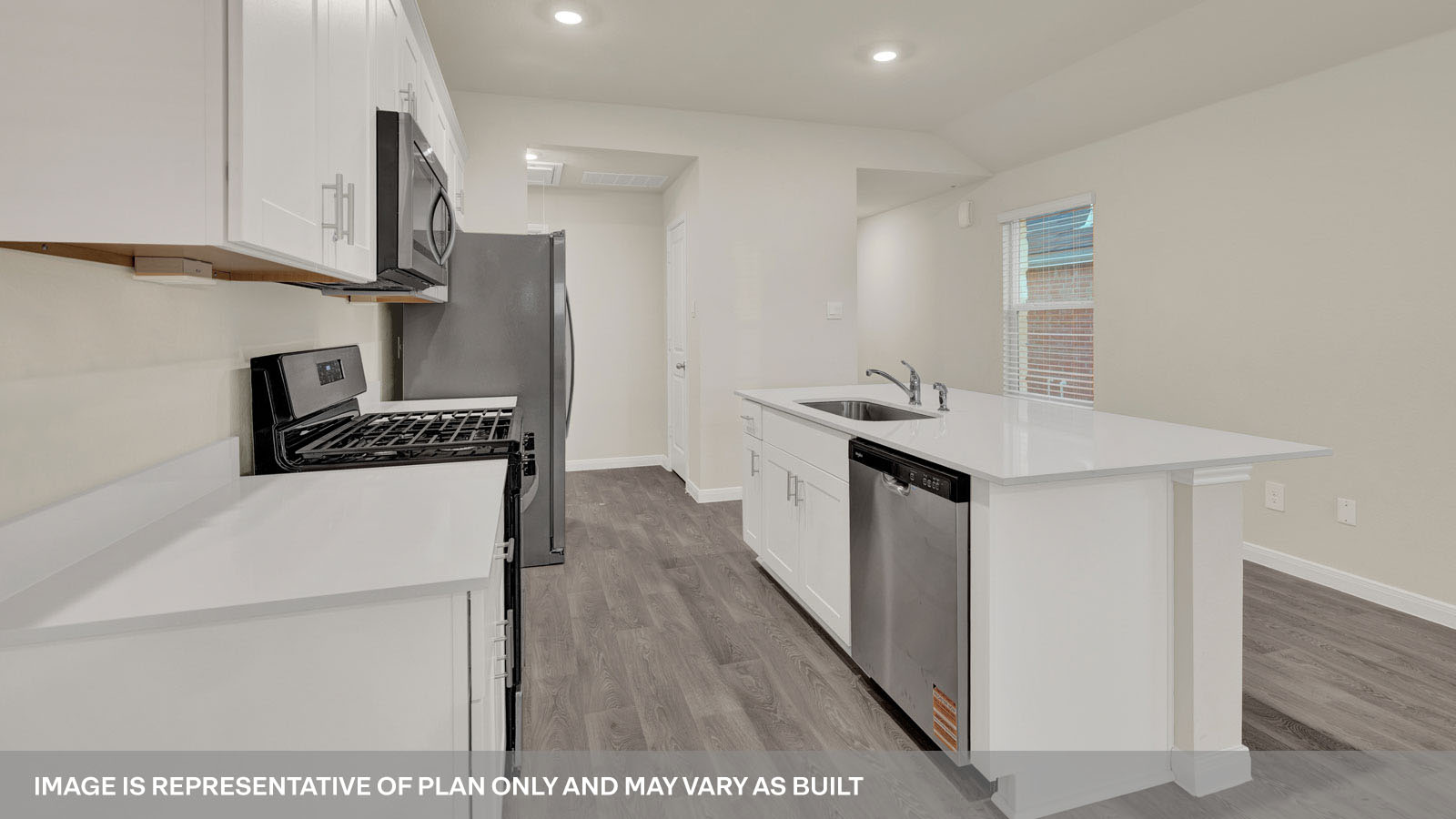 kitchen with white cabinetry, large island, and stainless steel appliances