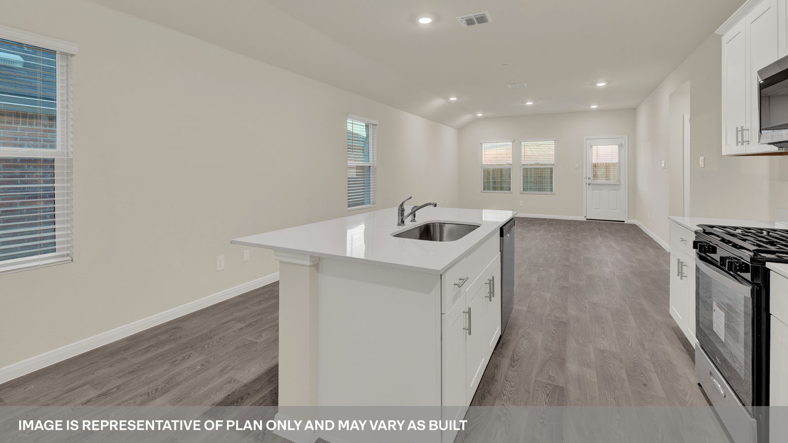 kitchen with white cabinetry, large island, and stainless steel appliances
