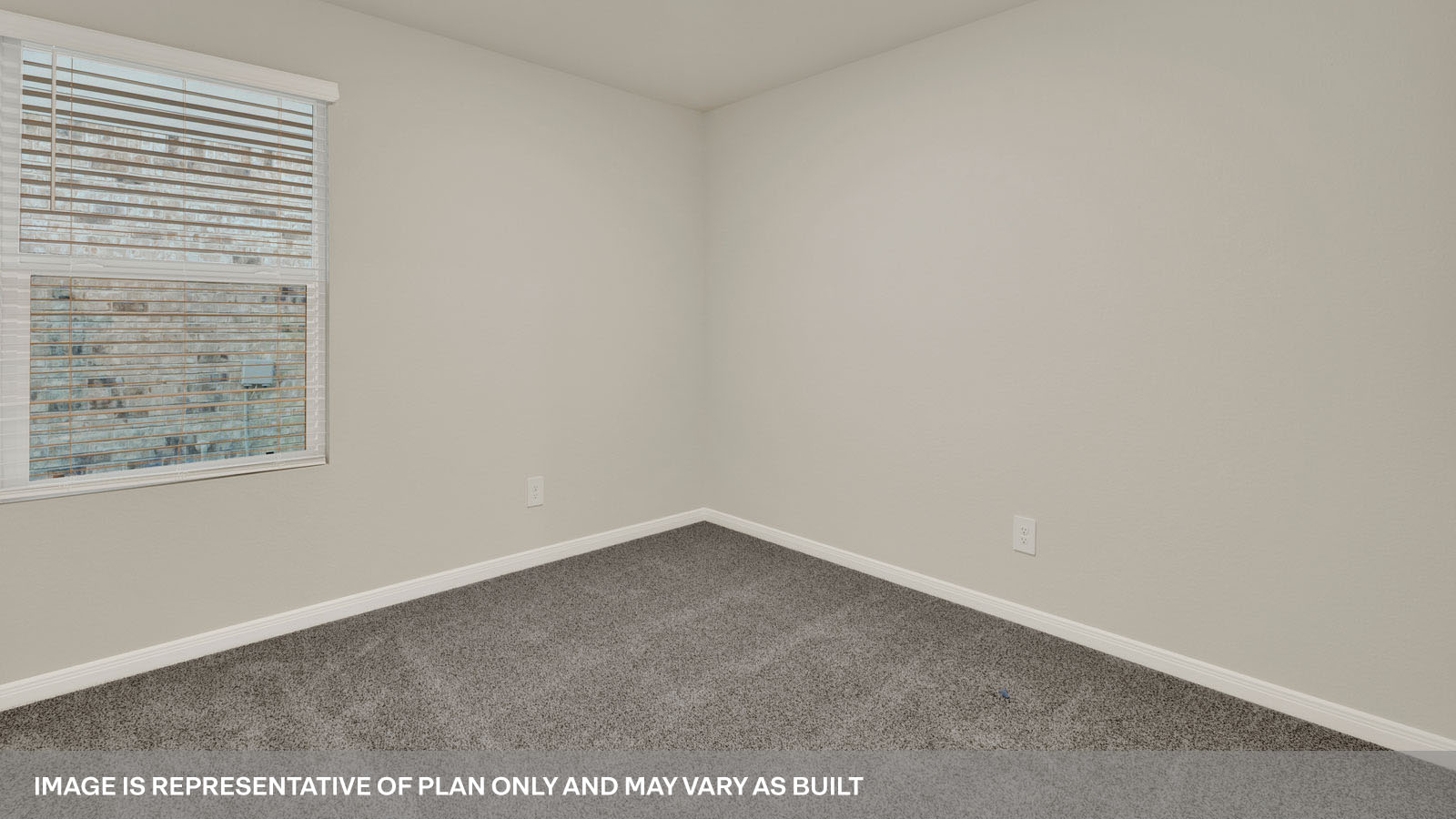 bedroom with beige carpet, beige walls and a window