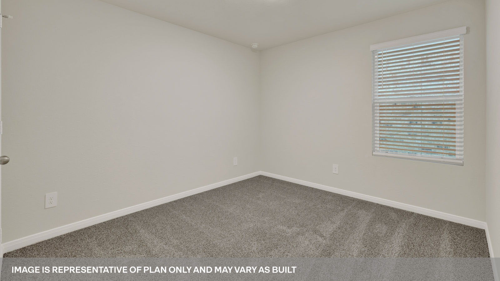 bedroom with beige carpet, beige walls and a window