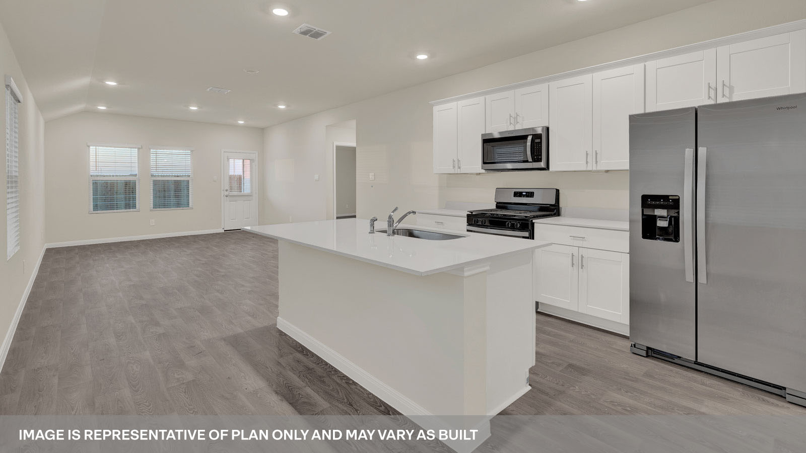 kitchen with white cabinetry, large island, and stainless steel appliances
