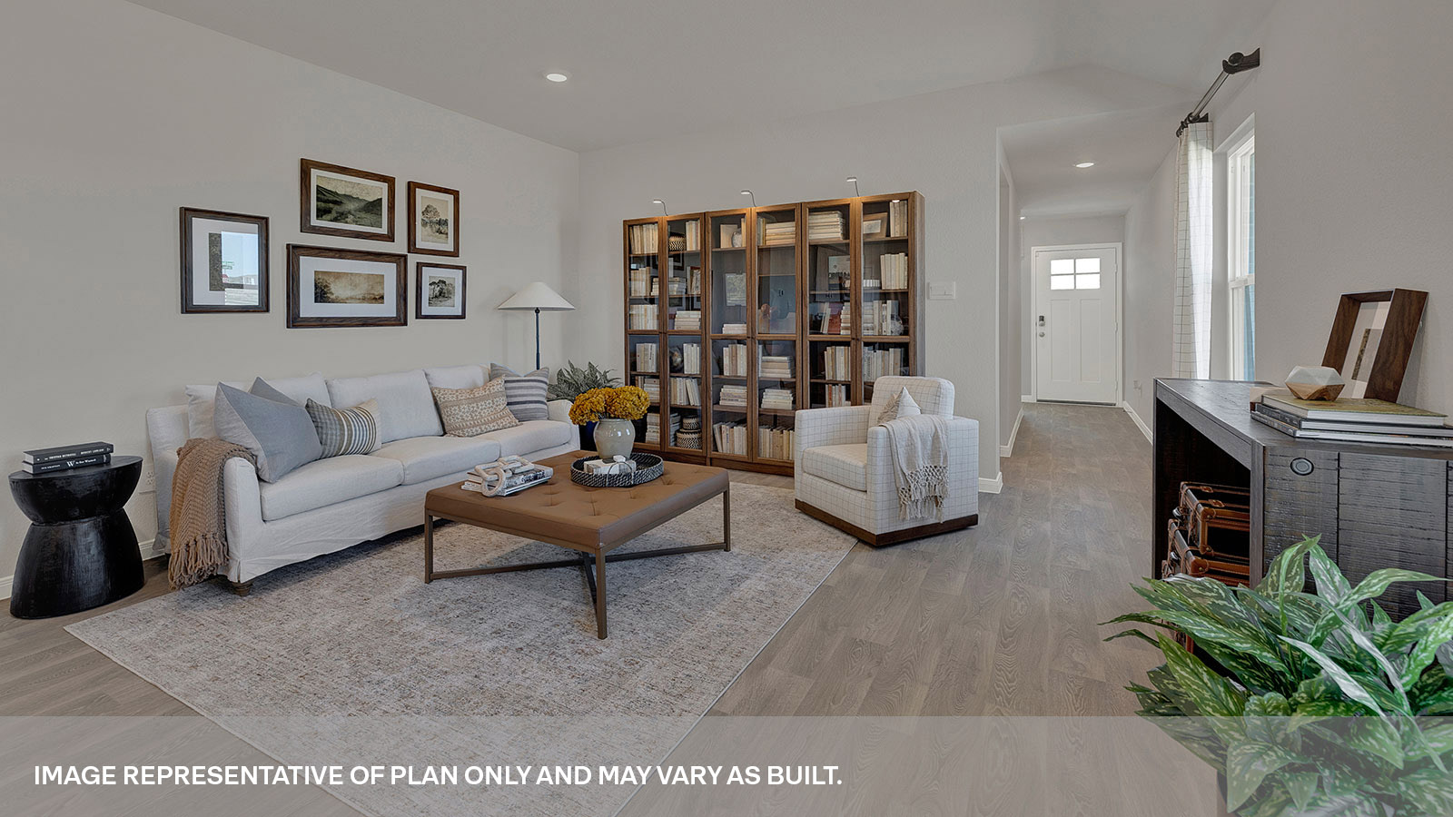 Living room with vinyl flooring and entry hallway.