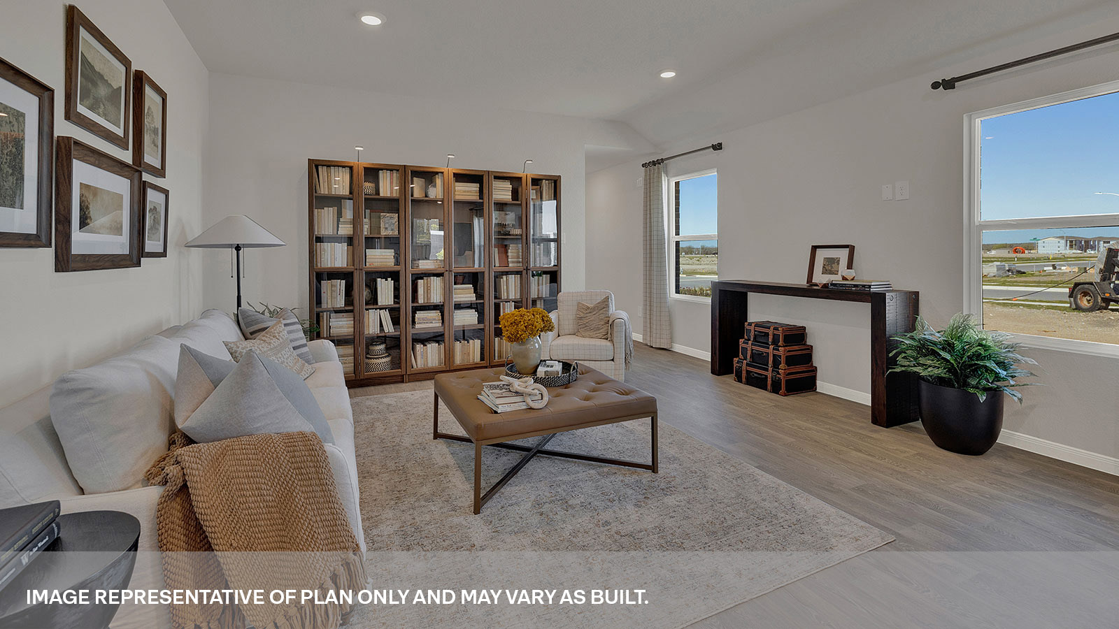 Living room with vinyl flooring and entry hallway.