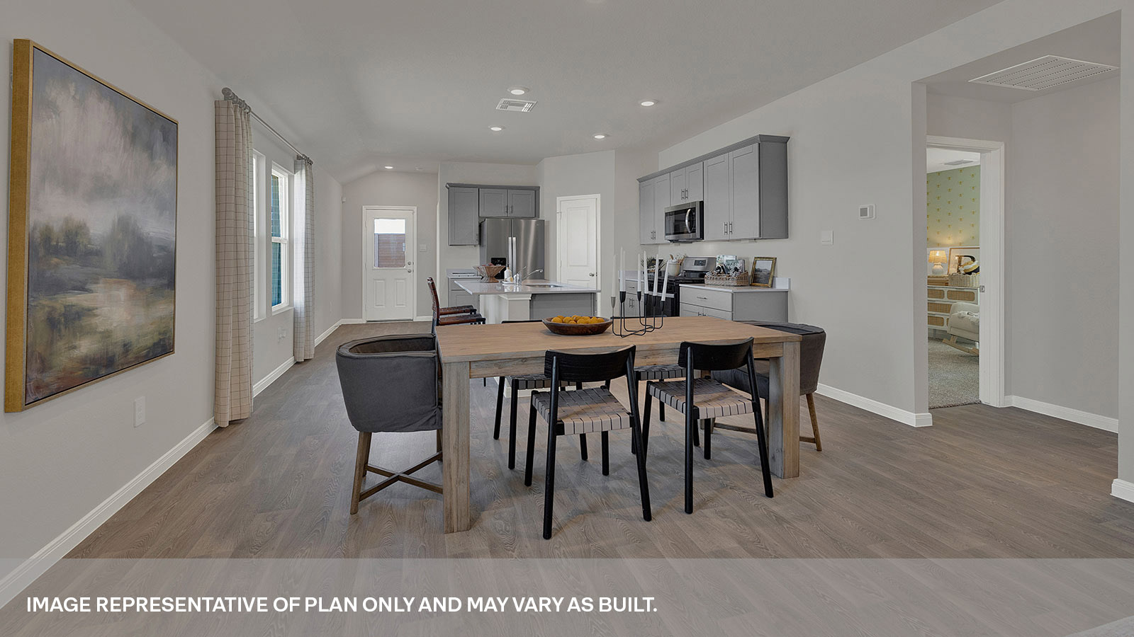 Dining room and living room with vinyl flooring and 2 windows.