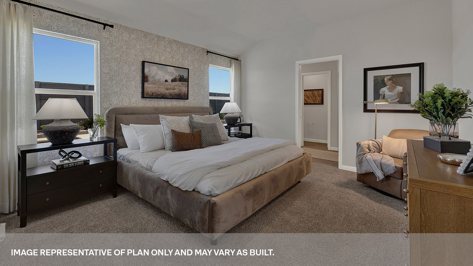 Main bedroom with carpeting and two windows.