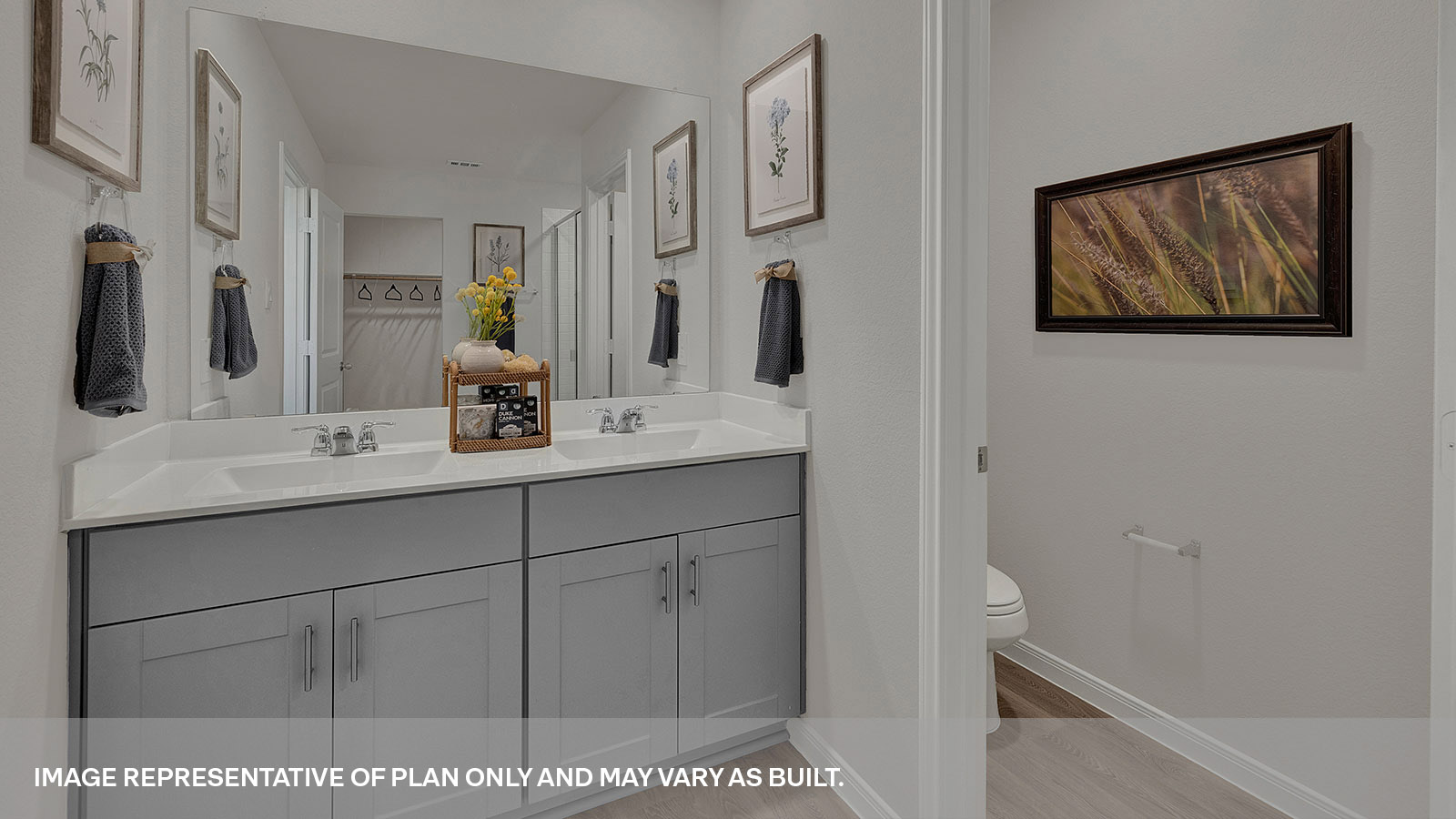 Main bathroom with double sink vanity and shower.