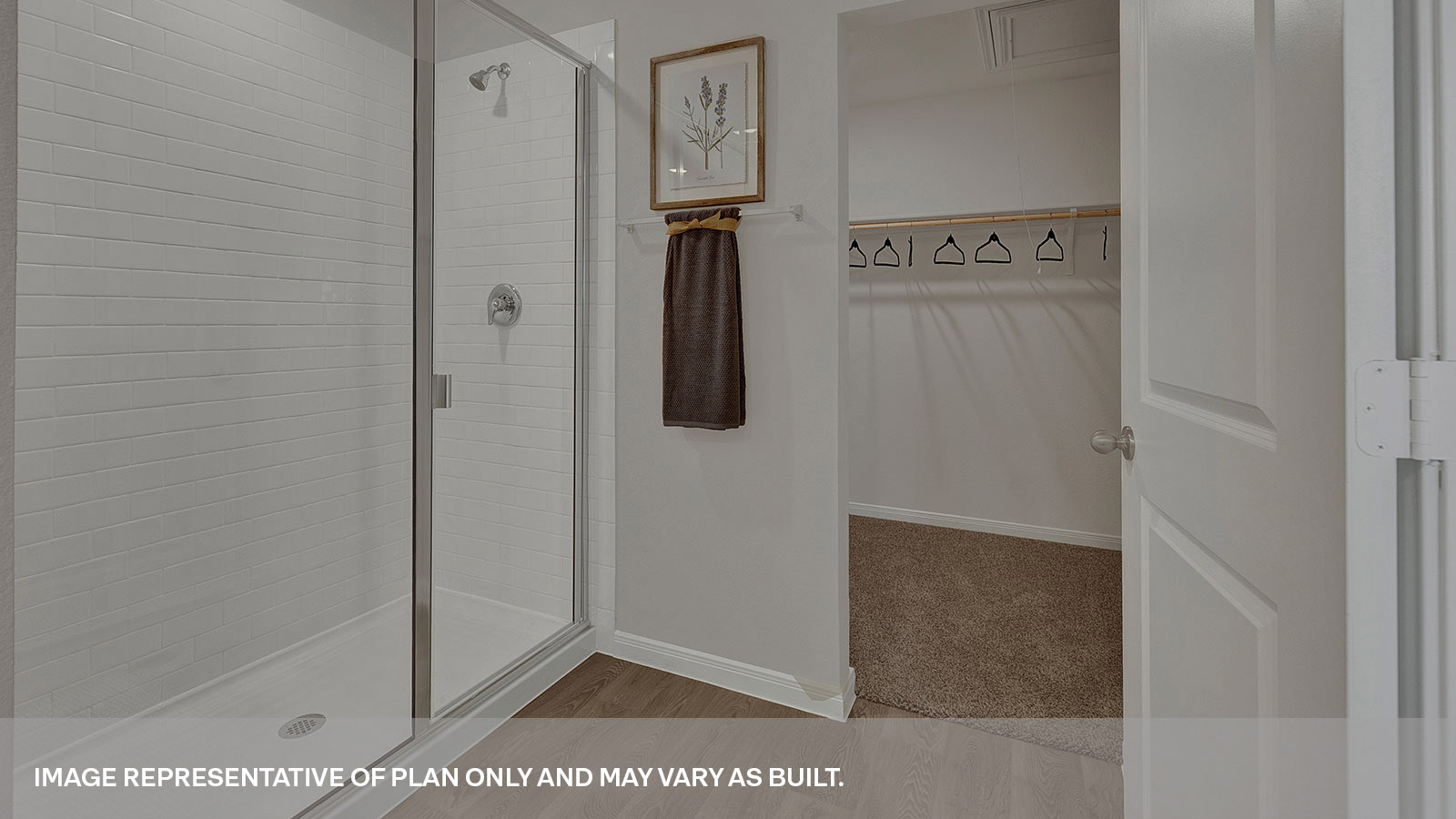 Main bathroom with double sink vanity and shower.