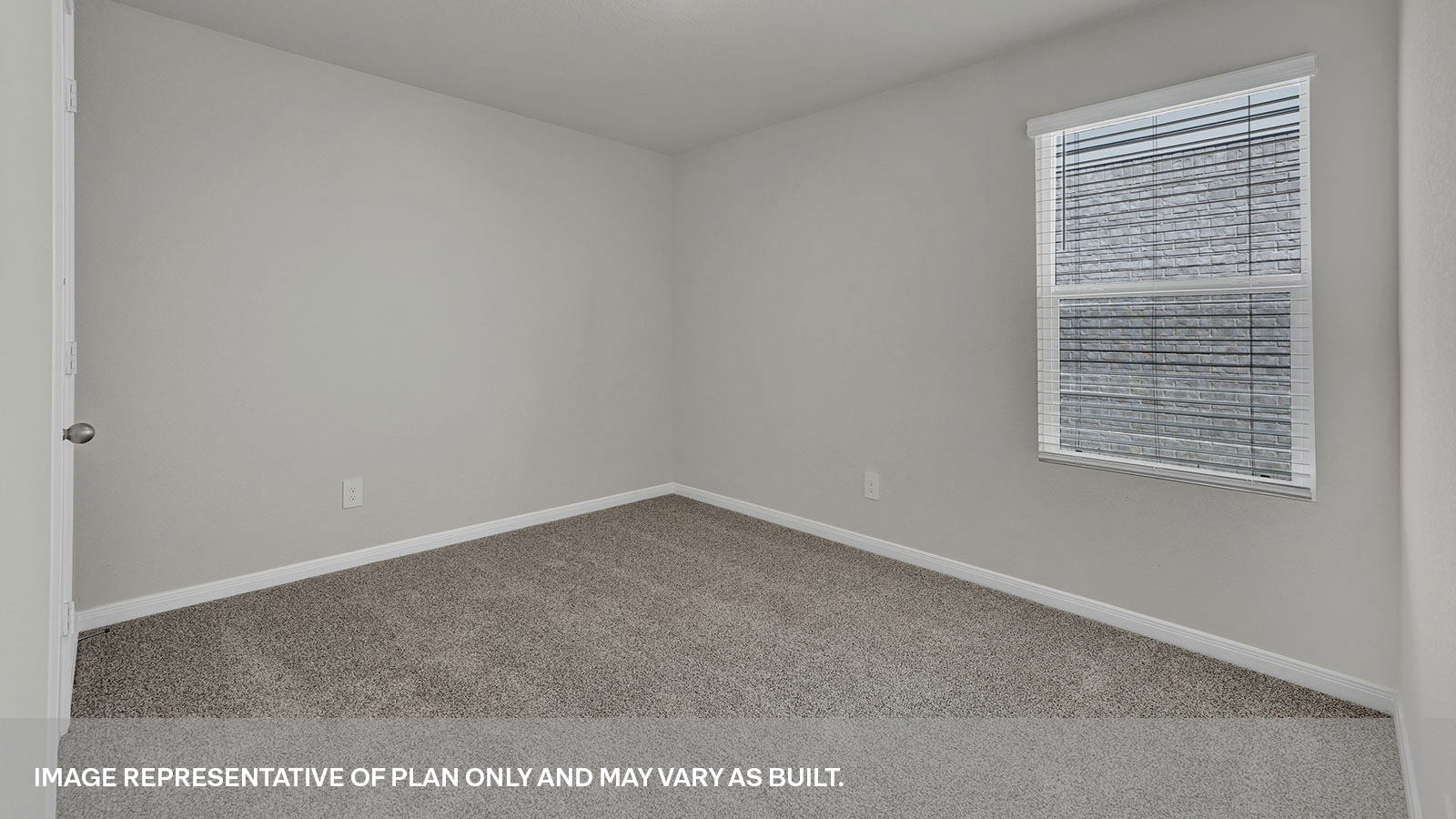 Secondary bedroom with carpeting and one window.