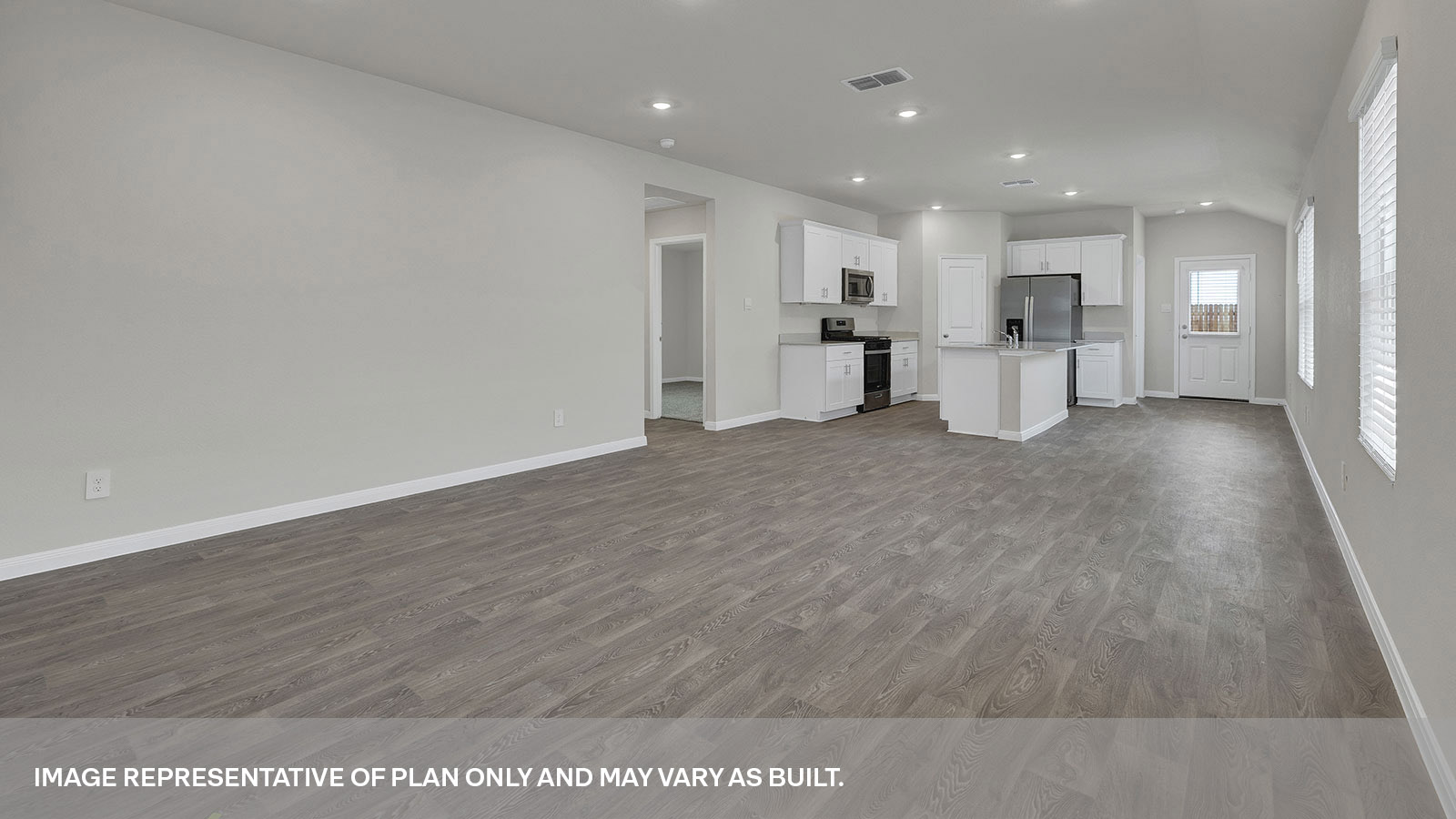 Living room opening to the dining room and kitchen.