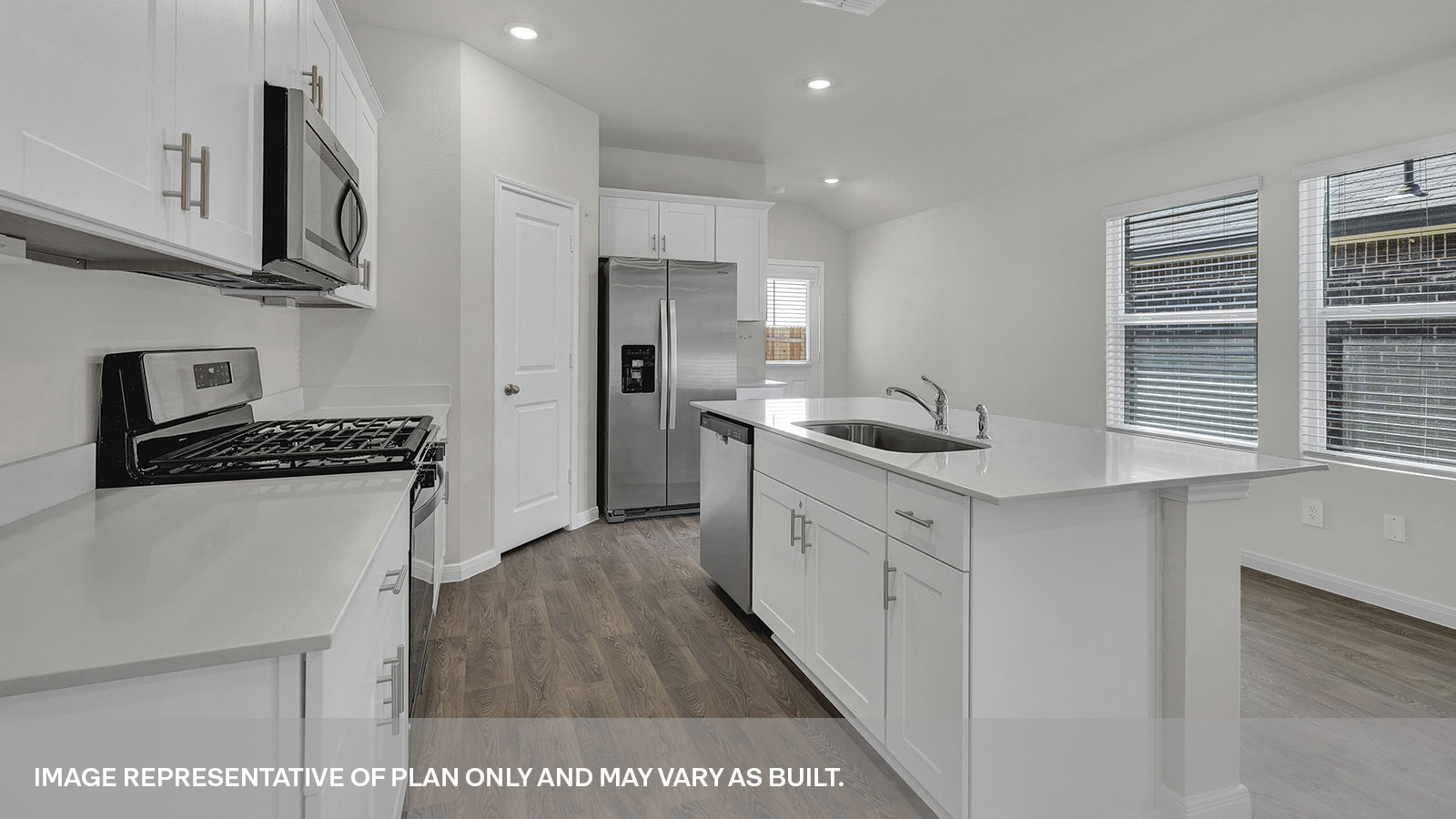 Kitchen with kitchen island and kitchen sink.