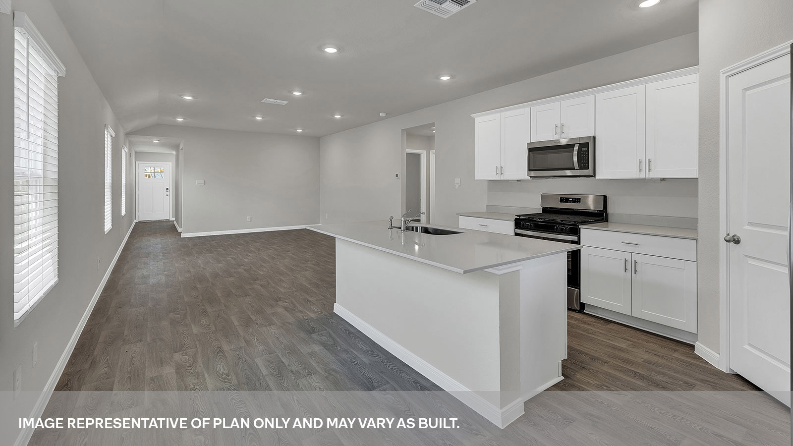 Kitchen opening to the dining room and living room.