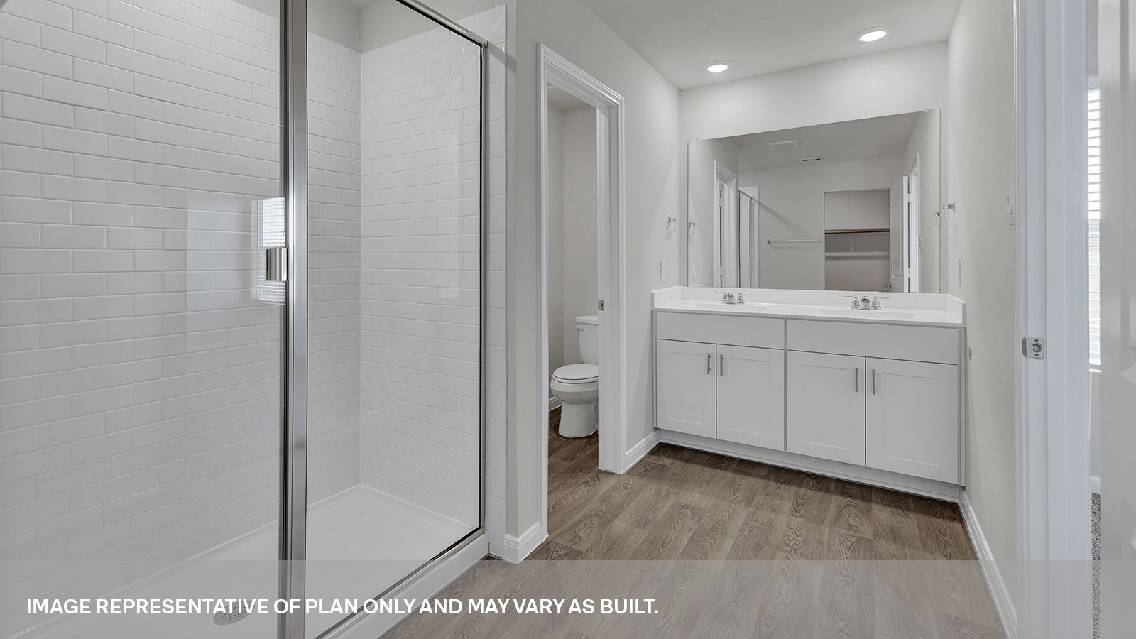 Main bathroom with double sink vanity and shower.