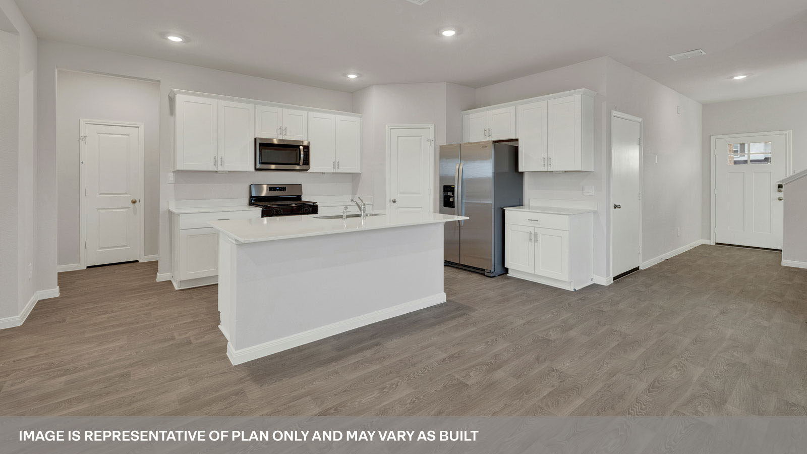 kitchen with white cabinetry, large island, and stainless steel appliances