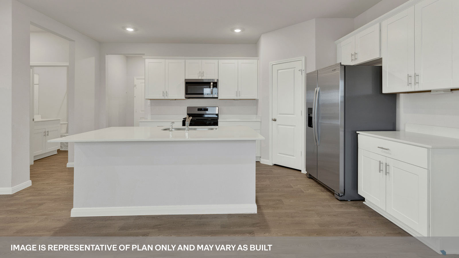 kitchen with white cabinetry, large island, and stainless steel appliances