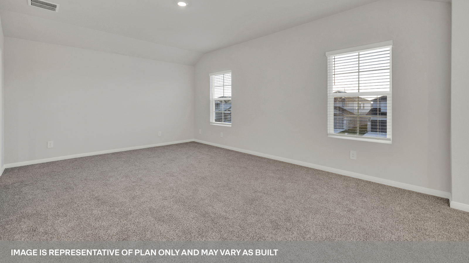 bedroom with beige carpet, white walls and a window