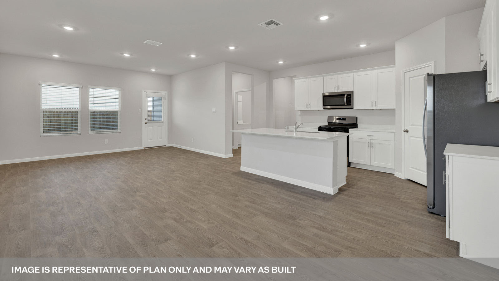 kitchen with white cabinetry, large island, and stainless steel appliances