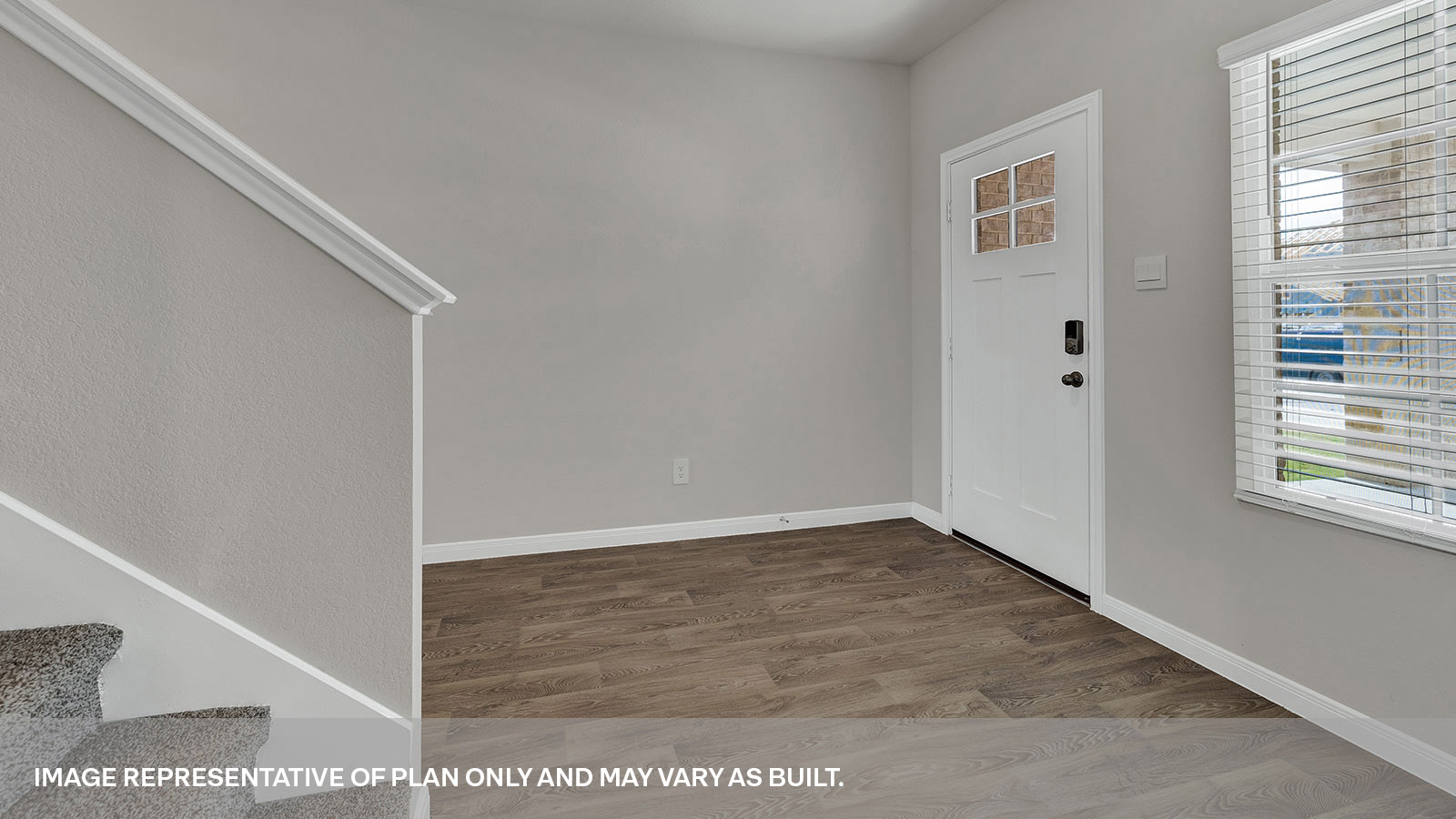 Entry with vinyl flooring and staircase.