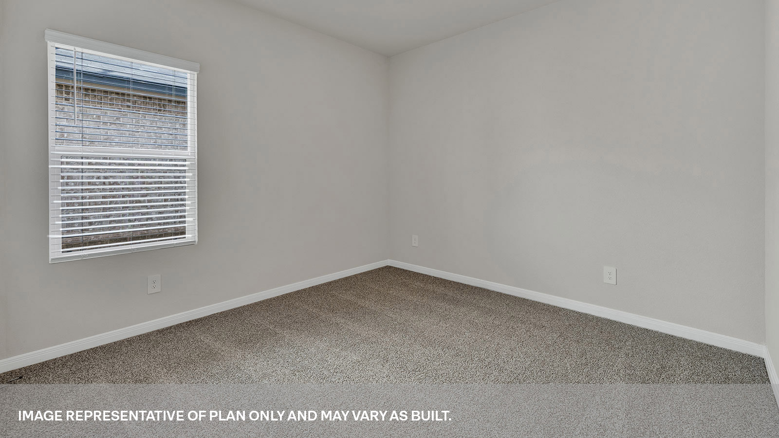 Front bedroom with carpeting and one window.
