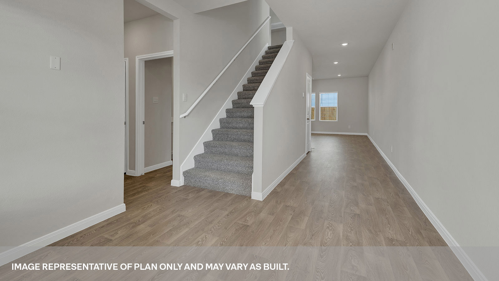 Entry hallway with bedroom hallway and staircase.