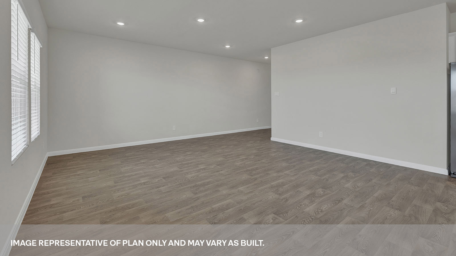 Living room with vinyl flooring.