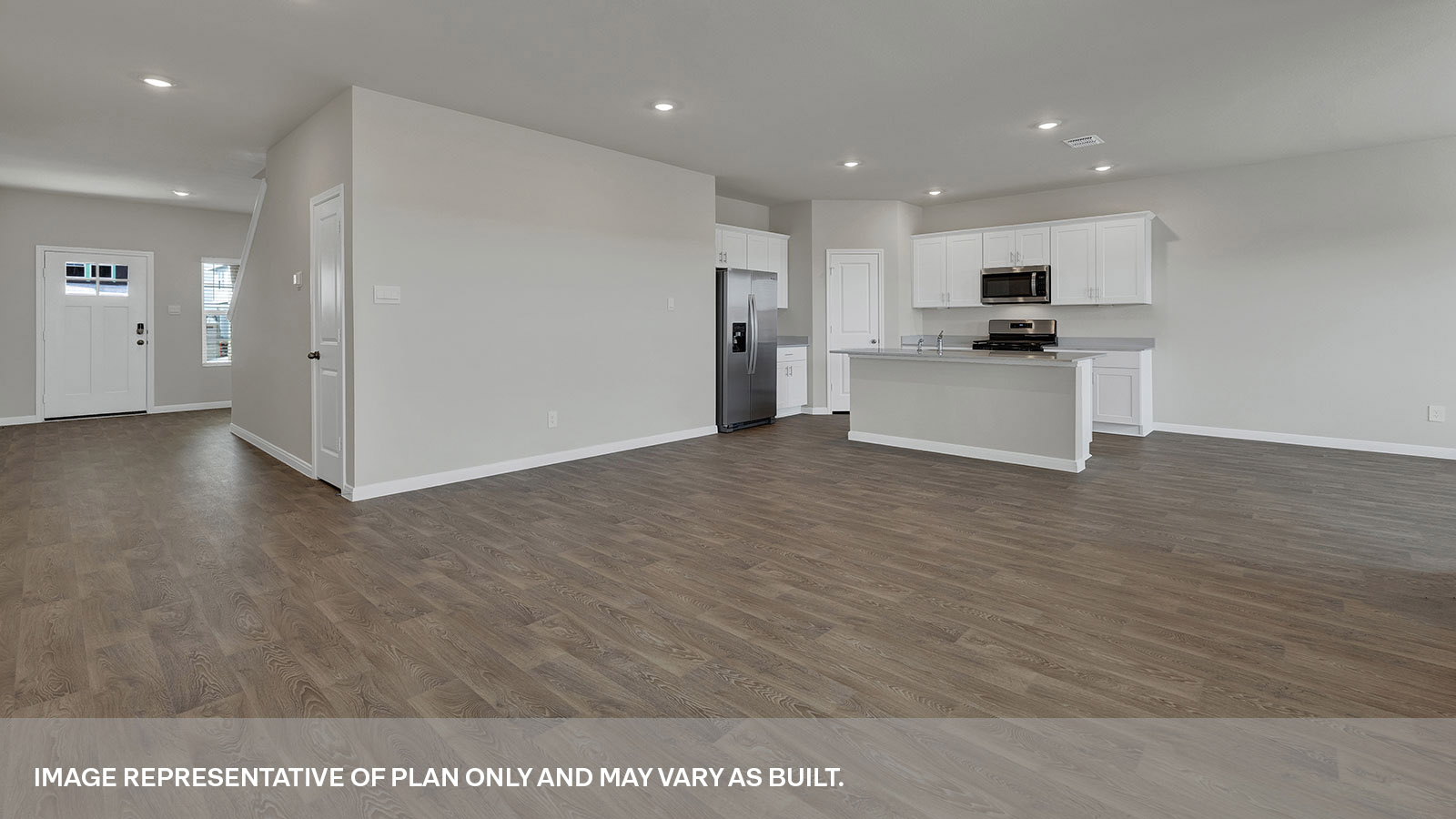 Living room opening to the entry hallway and kitchen.
