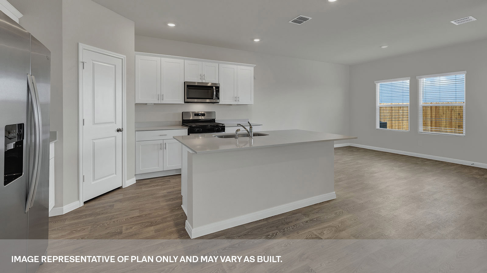 Kitchen and kitchen island opening to the dining room.
